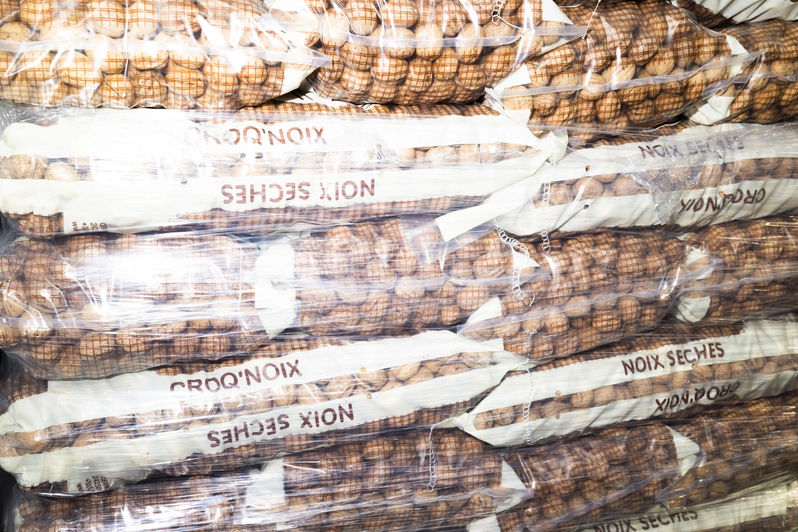 Stacks of bagged walnuts at Bananen + Frucht AG in Zurich, photographed as part of the new brand imagery.